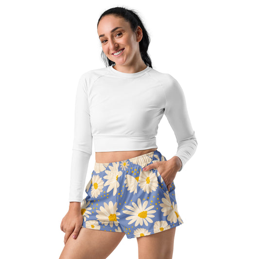Light blue daisy print athletic shorts for women with mesh pockets and white drawstring