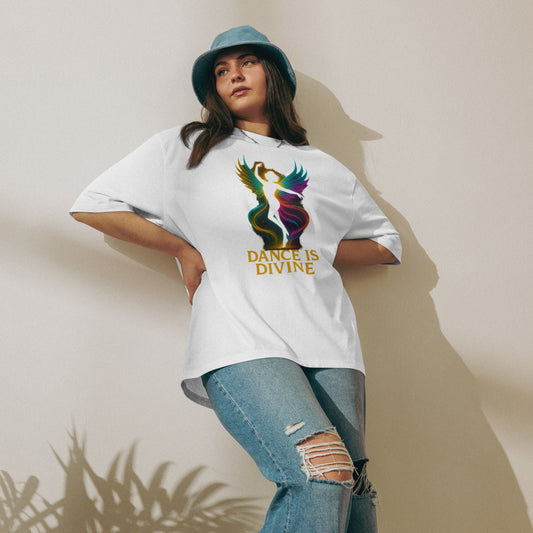 Woman wearing an oversized white t-shirt featuring a colorful dancing silhouette graphic – a blend of spiritual energy and relaxed streetwear