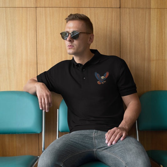 Man wearing black men’s polo with bold eagle embroidery and relaxed fit
